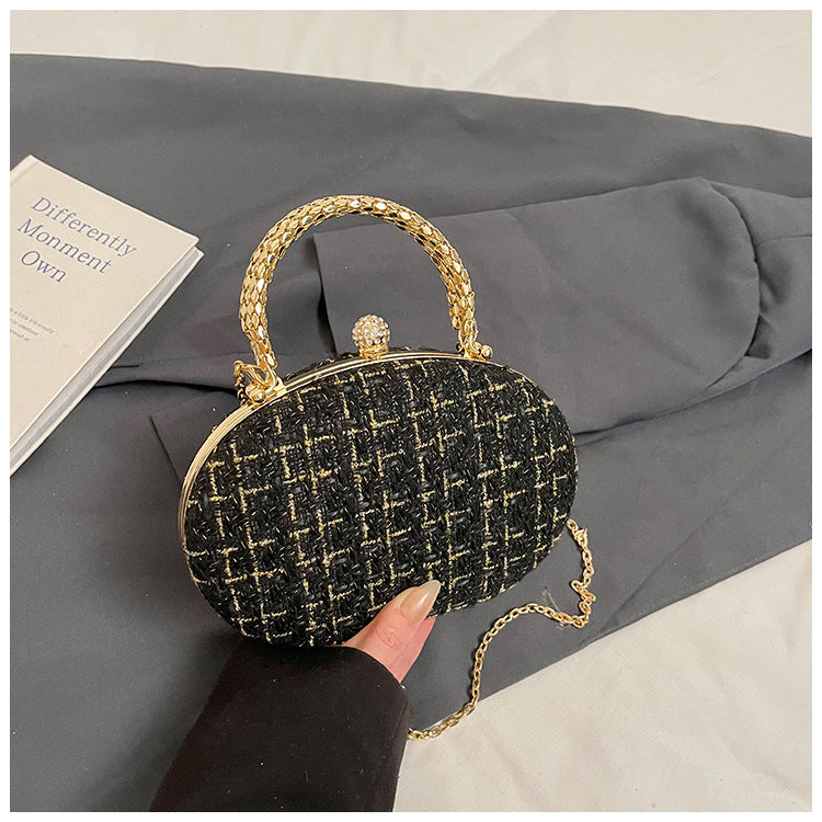 The Noire Luxe Oval Clutch – Black & Gold Plaid